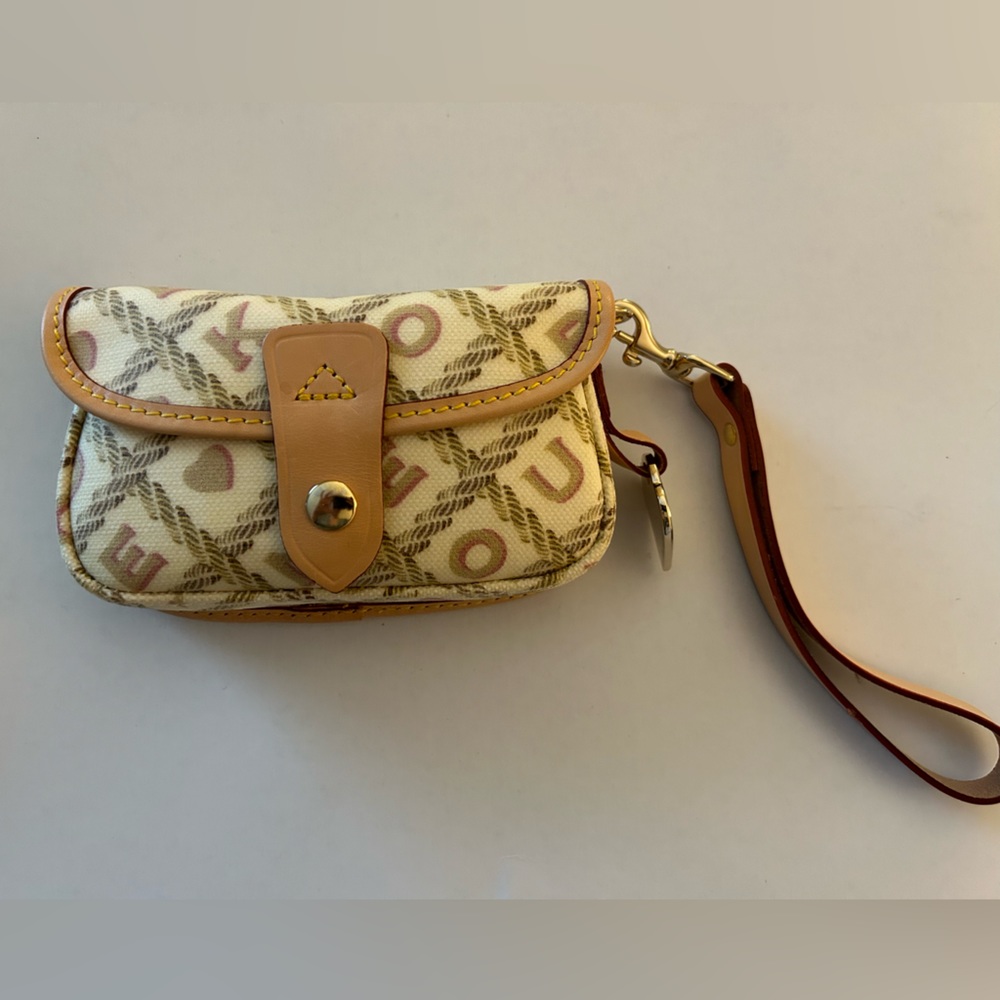 Dooney and Bourke monogrammed Ivory with DB monogram print lightly used wristlet